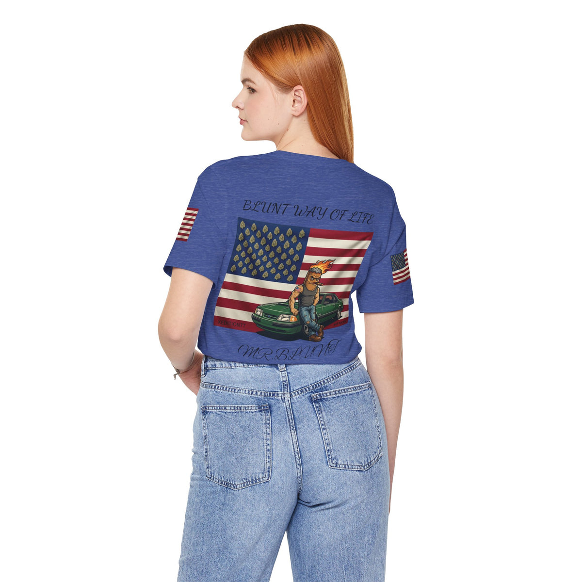 Model wearing blue Mr. Blunt tee with jeans, back view showing flag, character and green car artwork.