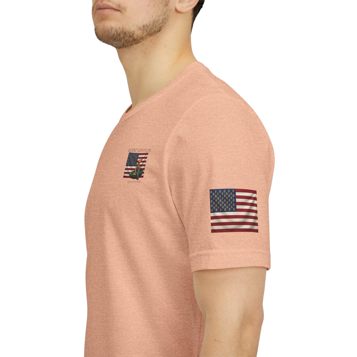 Close-up of peach Mr. Blunt tee showing leaf-pattern American flag sleeve print and small chest graphic.