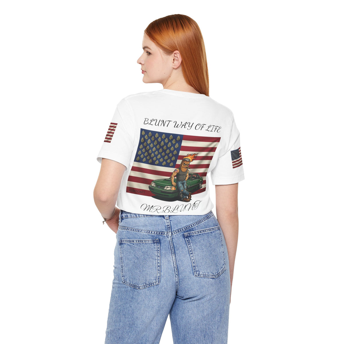 Model wearing white Mr. Blunt tee with jeans, back view showing flag, character and green car artwork.